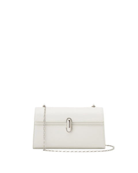White handbag with a chain detail on a light beige background