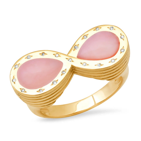 A gold ring in the shape of an infinity sign that features two pear-shape pink opals facing each other and lined with small diamonds set in the gold infinity setting.
