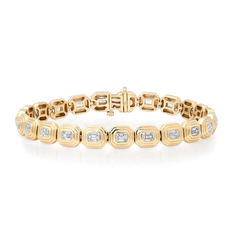 Gold bracelet with embedded diamonds on a white background