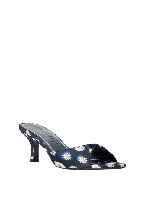 A single women's heeled mule sandal with a black base and a colorful floral print, shown against a plain white background.