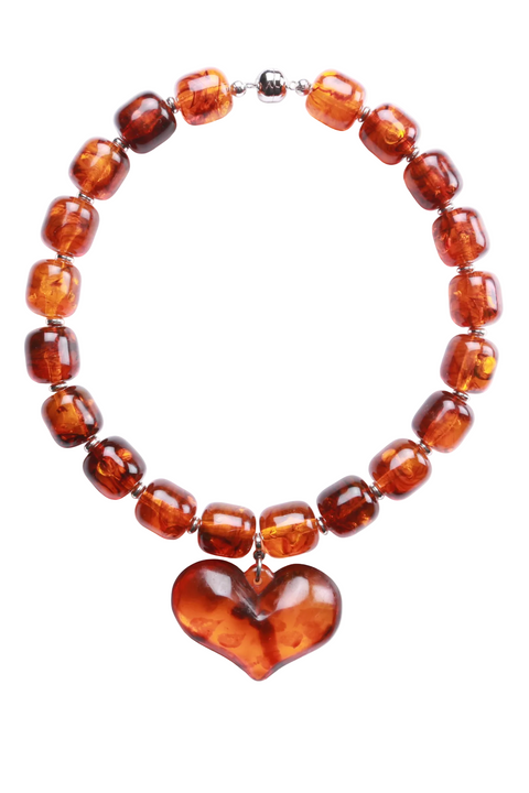 Amber necklace with a heart-shaped pendant on a white background