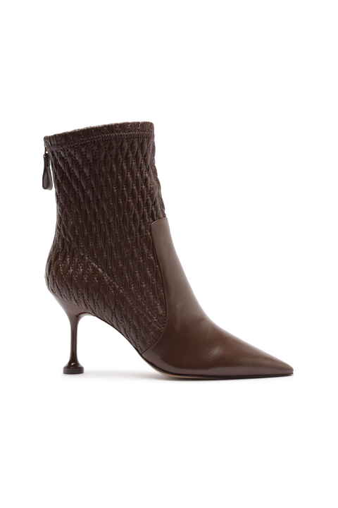 Brown fitted boot with a high heel on a white background