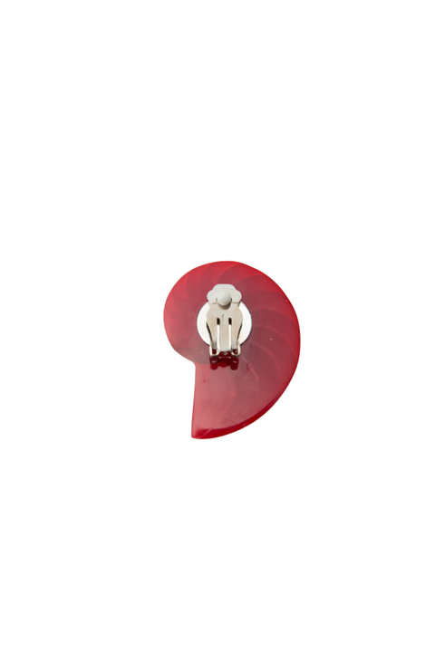 The back of a red colorful shell-shaped clip on statement earring