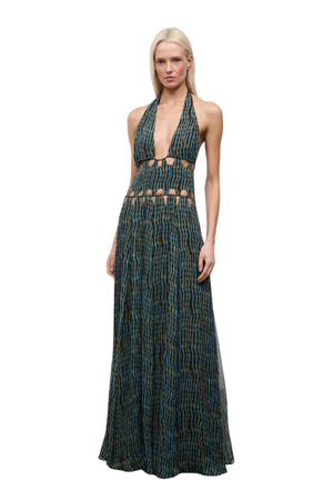 Woman wearing a blue and brown patterned halter neck maxi dress with cutouts