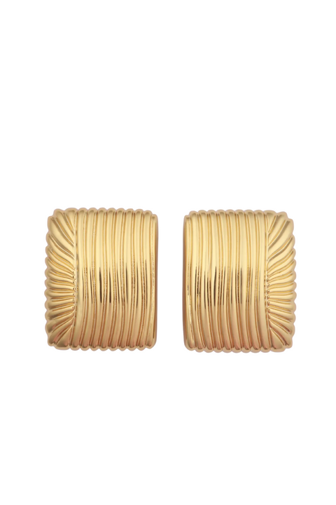 Pair of gold textured earrings on a light white background