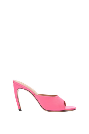 Neon pink high-heeled shoe on a white background