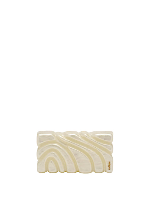 Textured pearlescent clutch with ornate design.