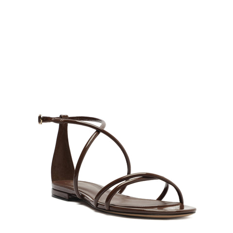 Front angle view of patent leather brown strappy sanda.