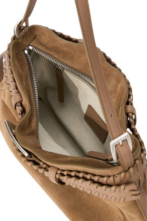 Close-up of a brown suede shoulder bag with braided leather trim, showing the interior zippered compartment and light beige lining.