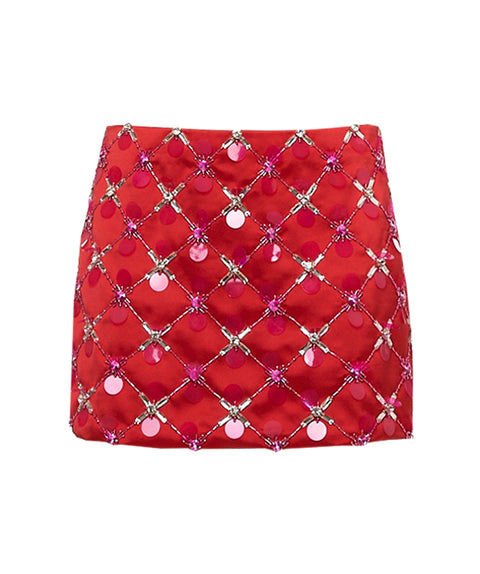 Red mini skirt with pink and silver embellishments on a white background