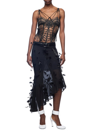 Black lace top and skirt set on a white background