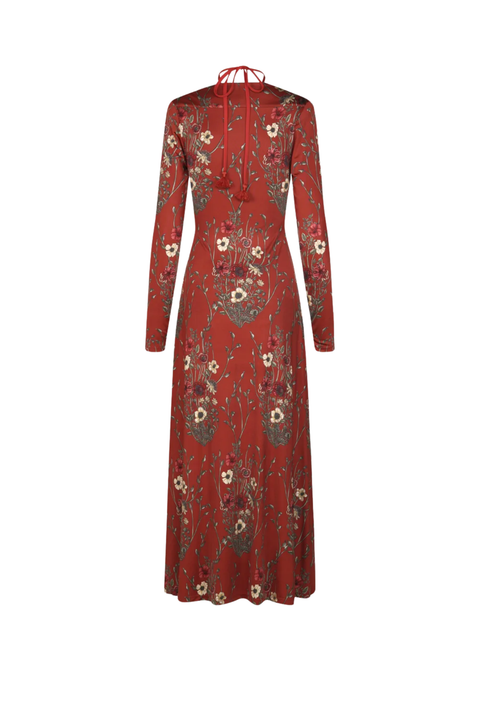 A long-sleeved red maxi dress with a high neck and delicate floral embroidery, shown against a plain white background.