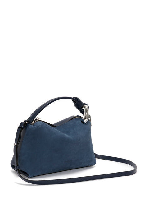 Side view of blue suede jwa bag with crossbody strap.
