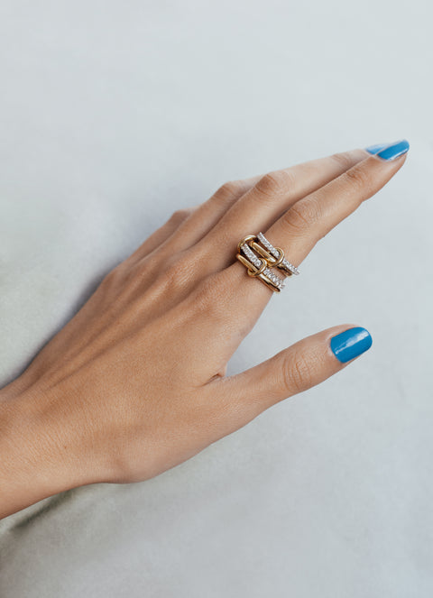 A woman wearing a Spinelli Kilcollin Halley ring.