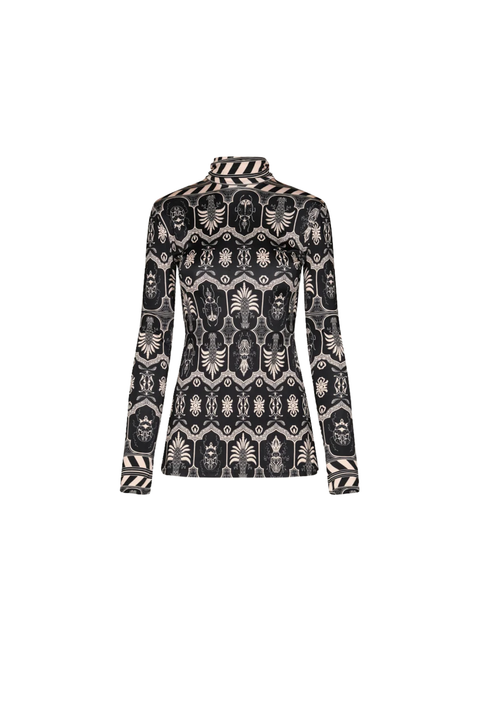 A long-sleeve mock neck top featuring a black, beige, and white ornate pattern print, shown against a plain white background.