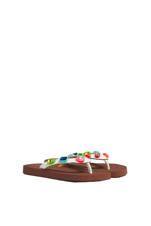 Flip-flop sandals with colorful gems on a light gray background