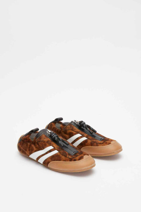 Frontal view of leopard print sneaker with white stripes on a white background