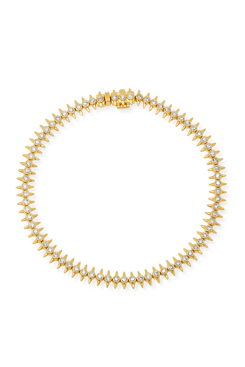 Gold diamond bracelet with spikes.