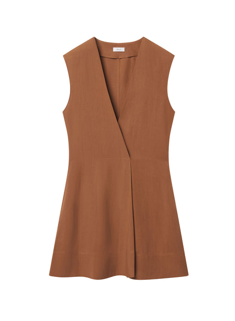 Flat lay of rust mini dress with v-neck and white background