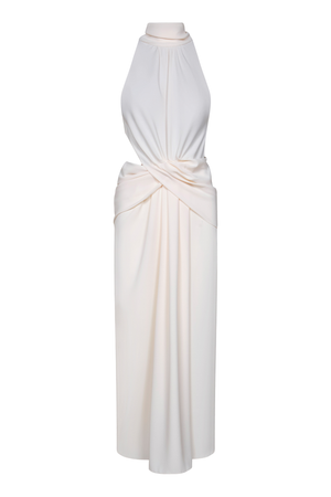 An ankle-length cream halter dress with side draping and a cutout