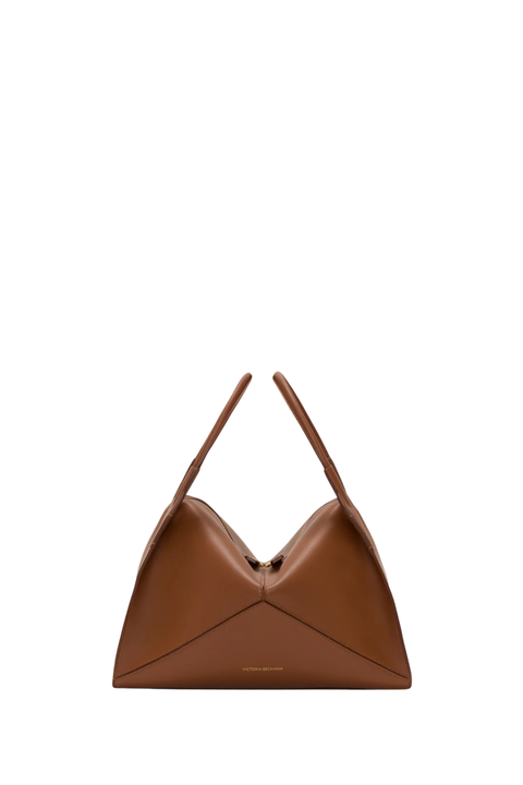 A tan leather handbag with a v-shape and top handles