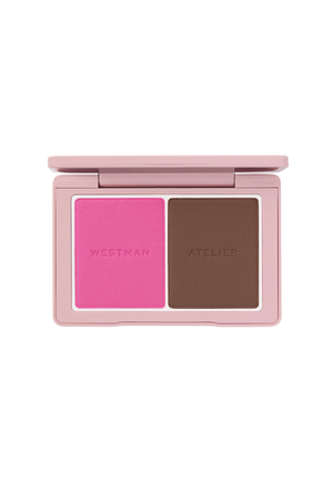 A Westman Atelier two-pan makeup compact, open to reveal a bright pink blush and a medium brown contour powder, set against a plain white background.