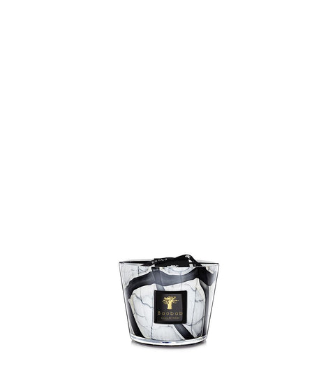 A small hand blown grey marble patterned glass candle with black strokes and beige edges, with a wick