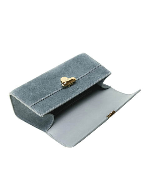 Blue velvet jewelry box with a gold heart clasp on a white background