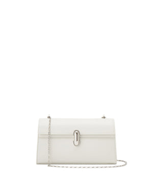 White handbag with a chain detail on a light beige background