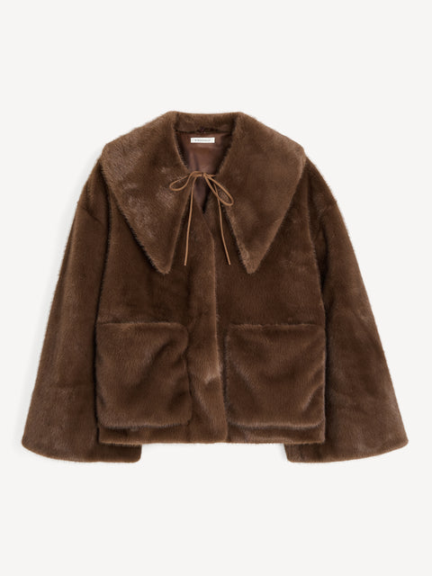 A brown faux fur coat that features a pointed collar, neck tie, and front pockets. 