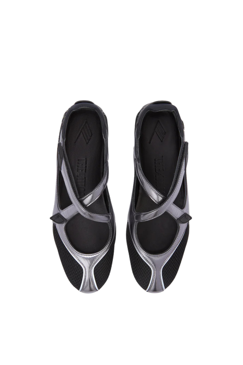 A pair of black ballet flats with metallic silver geometric accents on the toes and straps, shown from a top-down view on a white background.