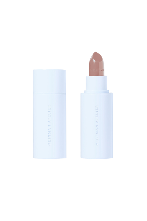 A lipstick bullet shown next to its cap on a clean white background. The lipstick bullet is a muted dusty rose or mauve shade, and the packaging is a matte white cylindrical tube with vertical branding text.