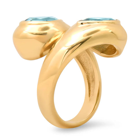 Ghost image of the side profile of a chunky toi-et-moi ring that features two blue topaz stones.