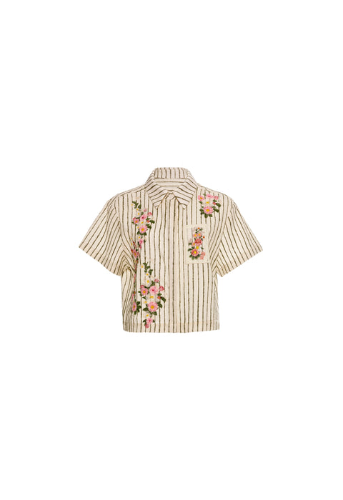 Flat lay of pinstripe cropped button down with floral designs