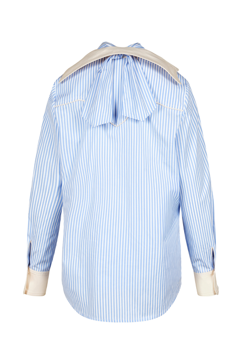 A light blue and white vertically striped long-sleeve blouse shown from the back, featuring a large tie-neck bow and contrasting beige cuffs.