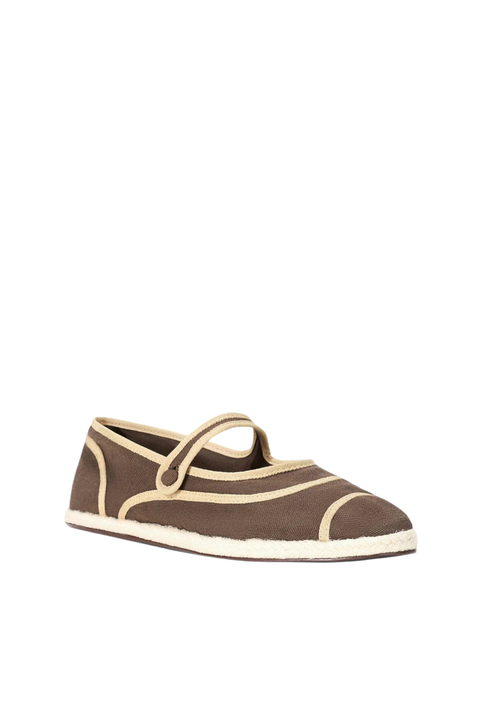 A single brown canvas slip-on shoe with beige trim and a matching strap, shown on a plain white background.