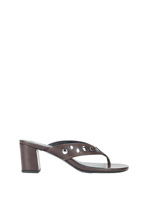 A dark brown leather thong sandal with a chunky block heel and decorative metal eyelets on the strap