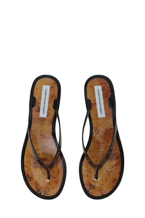 A pair of thong sandals shown from a top-down view on a plain white background. 