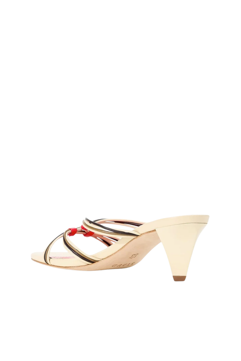 A single women's heeled sandal shown from the side against a plain white background. The sandal features a light beige block heel with thin black and red straps.
