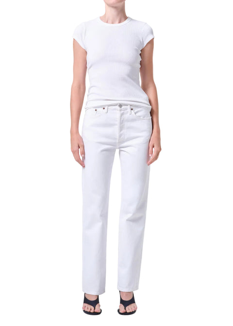 Person wearing a white t-shirt and white, mid-rise, straight-leg jeans on a white background facing forward