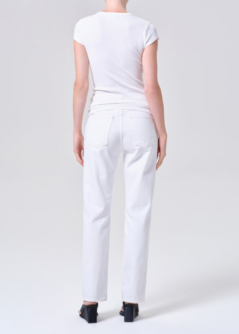 Back view of person wearing a white t-shirt and white, mid-rise, straight-leg jeans on a white background