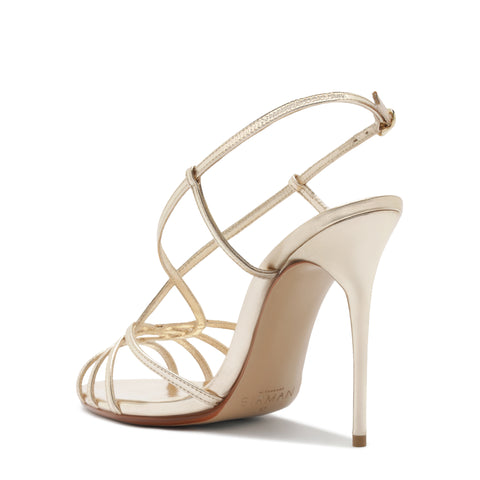 Beige high-heeled sandal with criss-cross straps on a white background