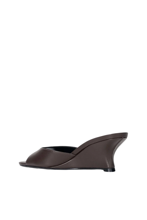 Brown wedge sandal on a white background