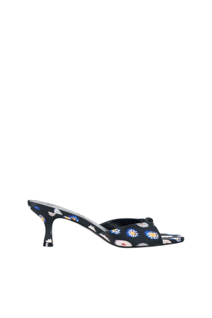 A single black pointed-toe mule sandal with a kitten heel, decorated with a colorful daisy and floral pattern, shown against a plain white background.