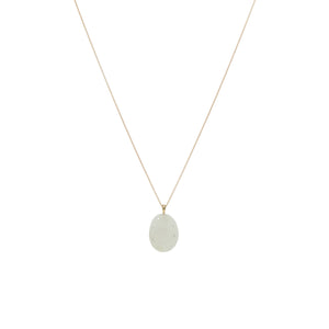 A white, oval stone embellished with miniature round diamonds, suspended on a gold chain. 