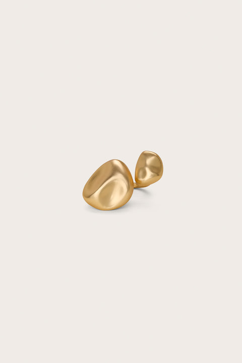 A gold-toned open design ring that features two abstract gold stones on each end. 