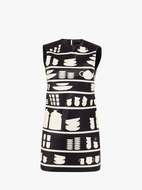 Black mini shift dress with white pattern on a white background