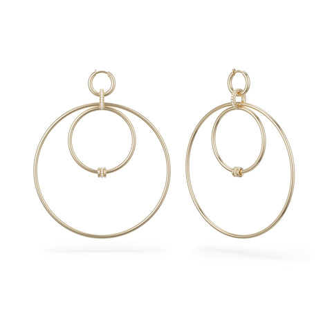 Ghost image of a pair of Spinelli Kilcollin Echo earrings the features a series of different sized yellow gold hoops with yellow gold annulets, some pave with diamonds. 