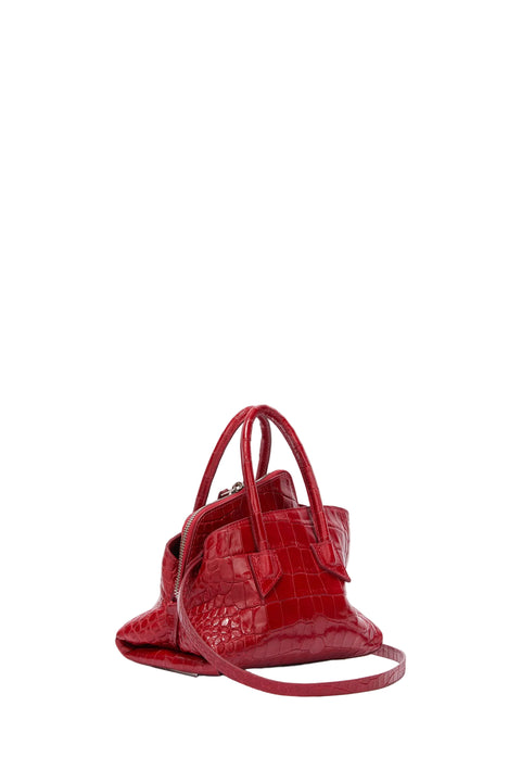 Red handbag with a textured pattern on a white background
