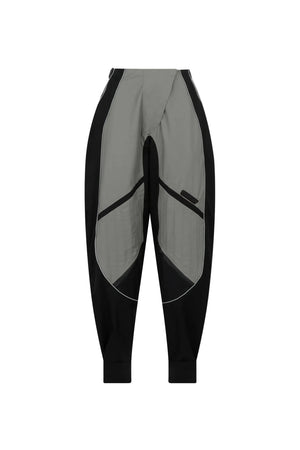 Gray and black athletic pants on a light gray background